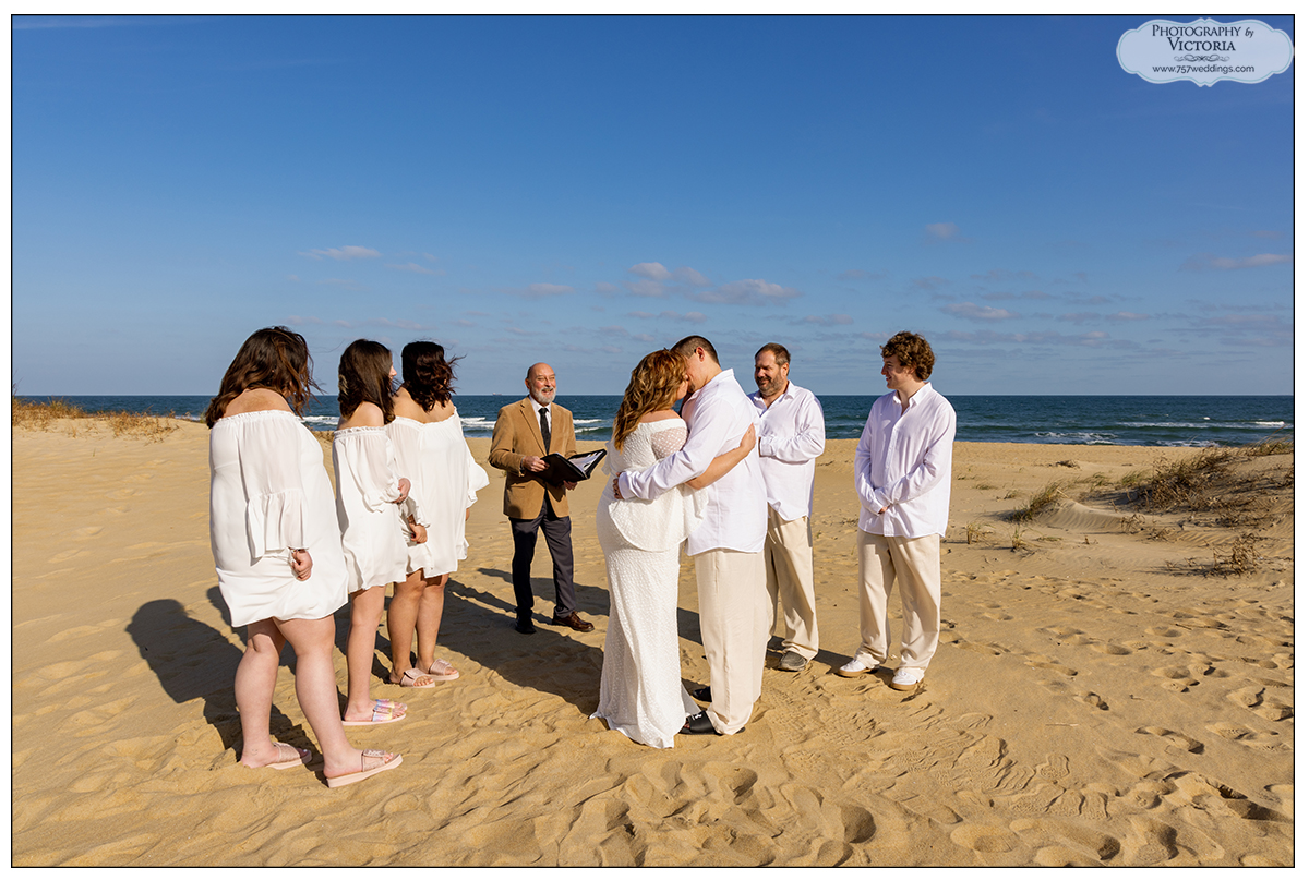 Sheri and Drew's December 2022 Sandbridge beach wedding officiated by Reverend Bruce Begault and photographed by Victoria Begault